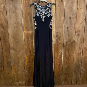 Black formal gown size 8 very sparkly, sheer cutouts and slit